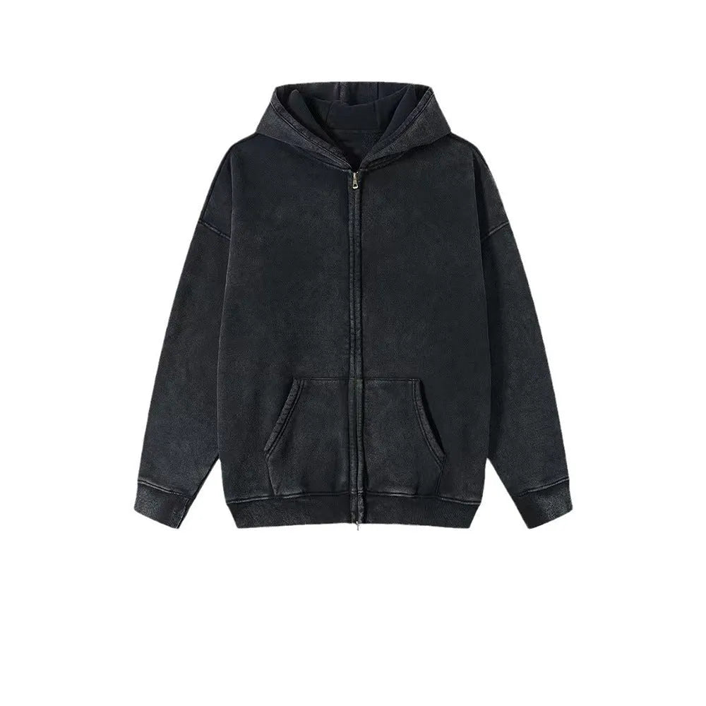 Man wearing a washed black fleece-lined hooded cardigan sweater with a double zip.