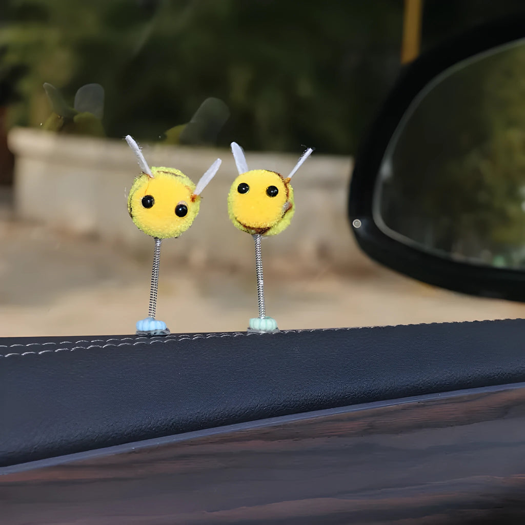 Swing spring bee car decoration made from soft fur ball, showing cartoon bee shape.