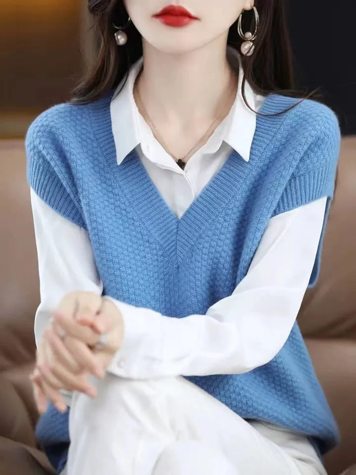 Creamy-white V-neck sleeveless knitted vest with a raised 3D pattern, laid flat.