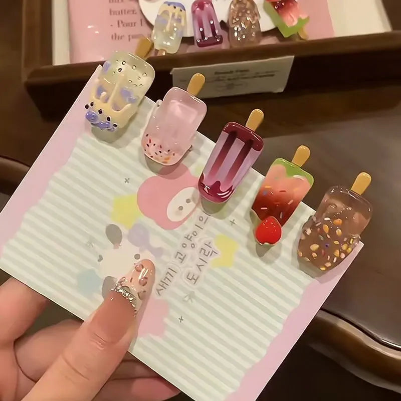 Resin ice cream design hair barrette with side clip fastening.