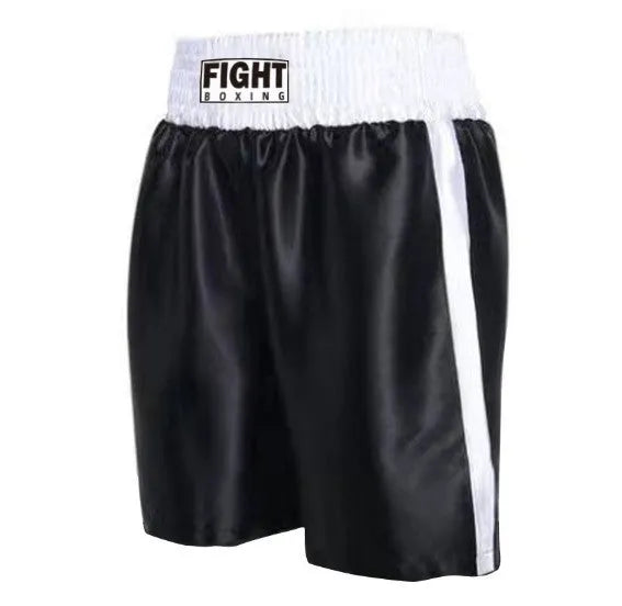 Man wearing black and white striped elastic waist kickboxing shorts in a training stance.