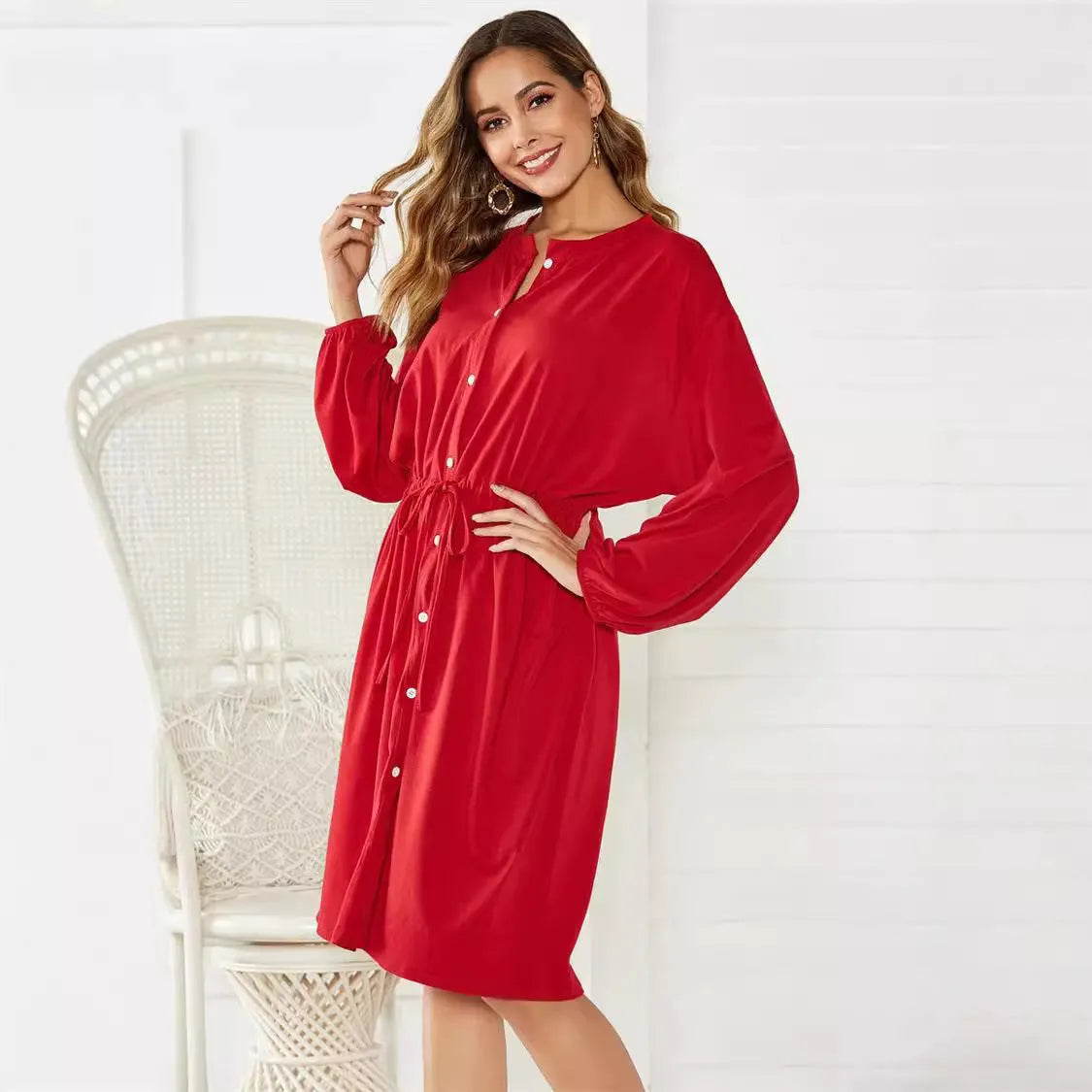 Women's black polyester dress with elastic waist, self-tie belt, and elastic cuffs on long sleeves