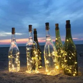 Copper wire LED string light with 20 bulbs and a white plastic bottle stopper for decoration.