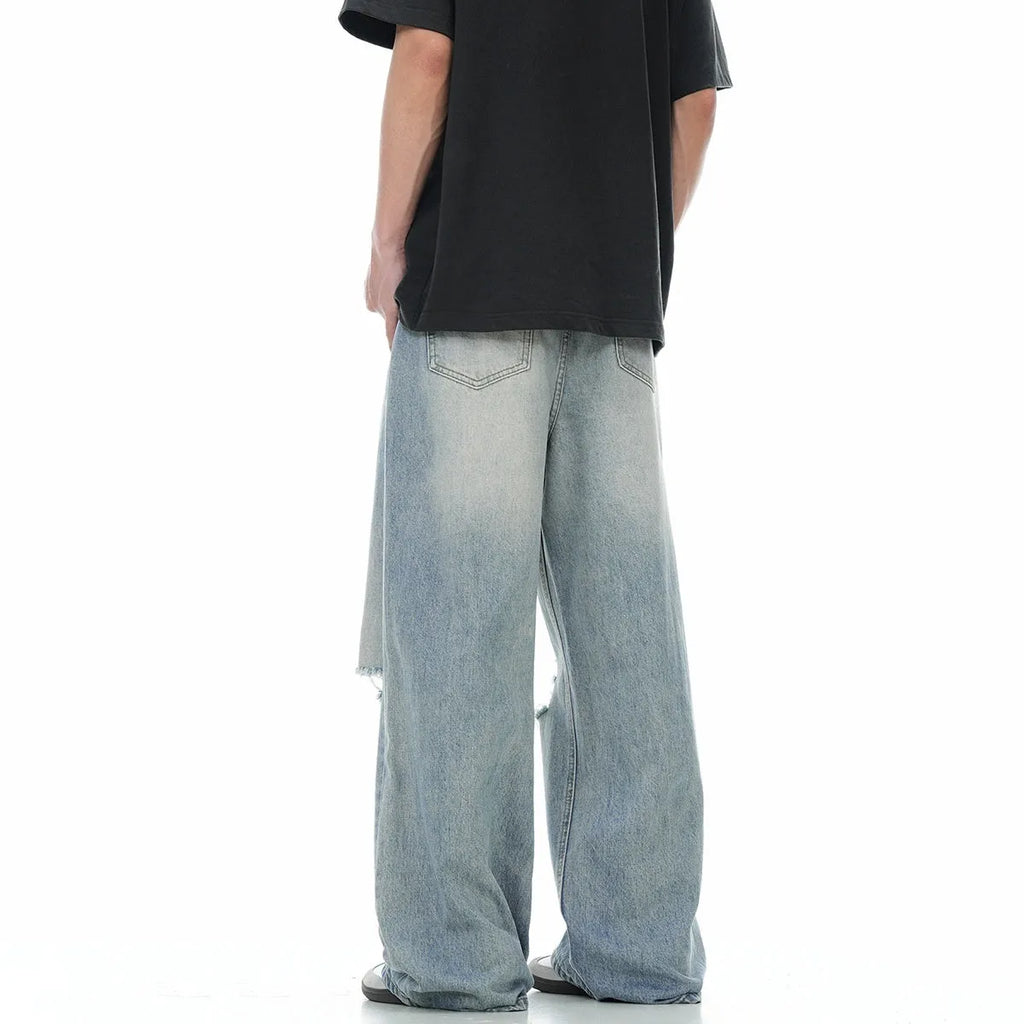 Blue men's straight-leg jeans with ripped knee detailing and a zipper fly