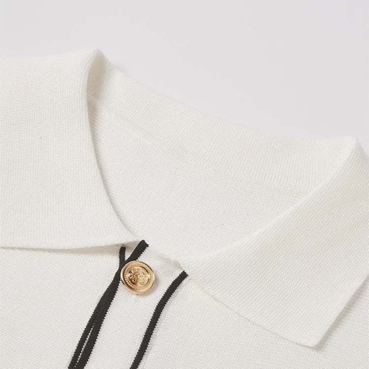 Women's white short sleeve cardigan shirt with contrast colour lapels on a hanger.