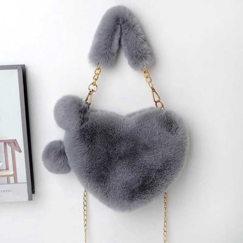 Soft plush heart-shaped women's handbag in medium size with zipper closure