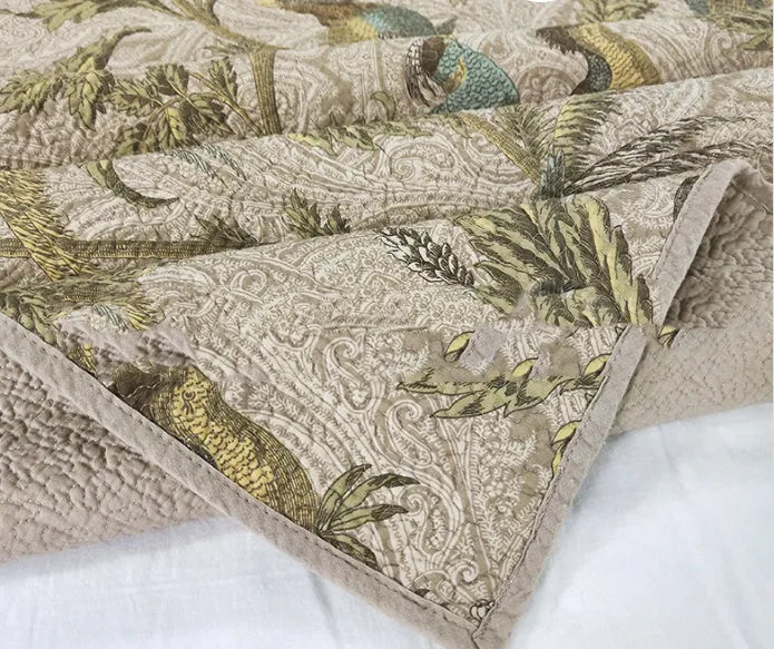 Blue American flower and bird pattern cotton bedspread set with three pieces shown on a bed
