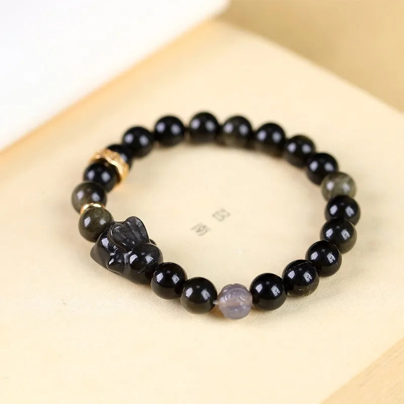 Handmade national style bracelet with lying rabbit charm made from jin yaoshi, agate, and brass.