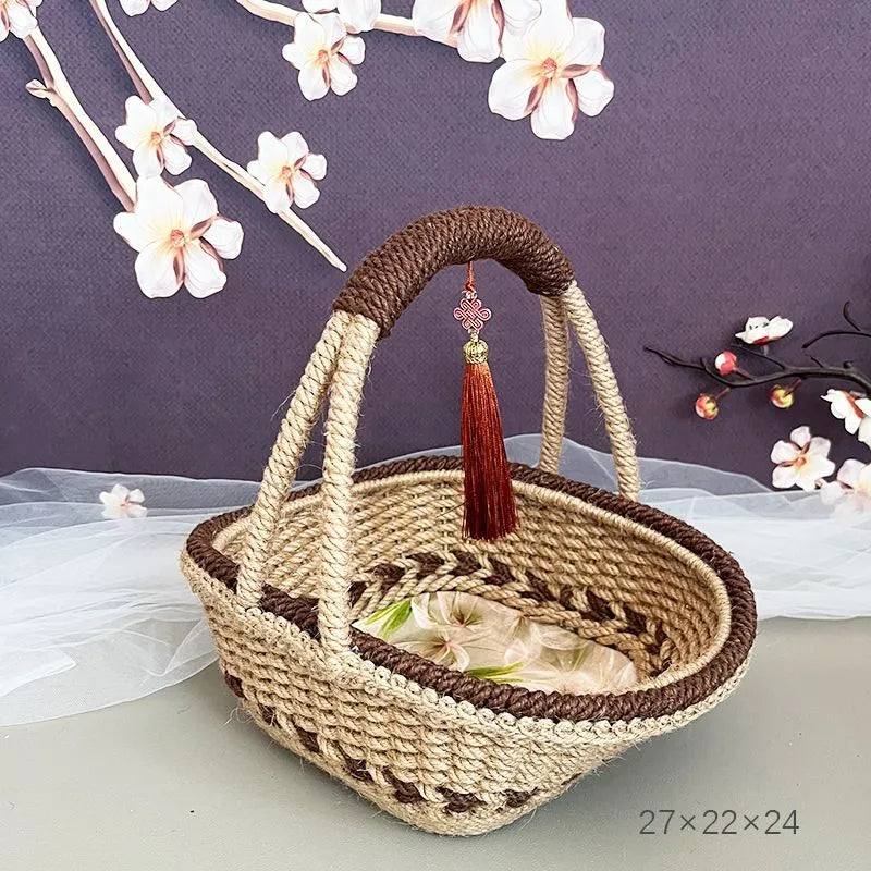 Small hand-woven straw basket in coffee brown colour on a wooden table.