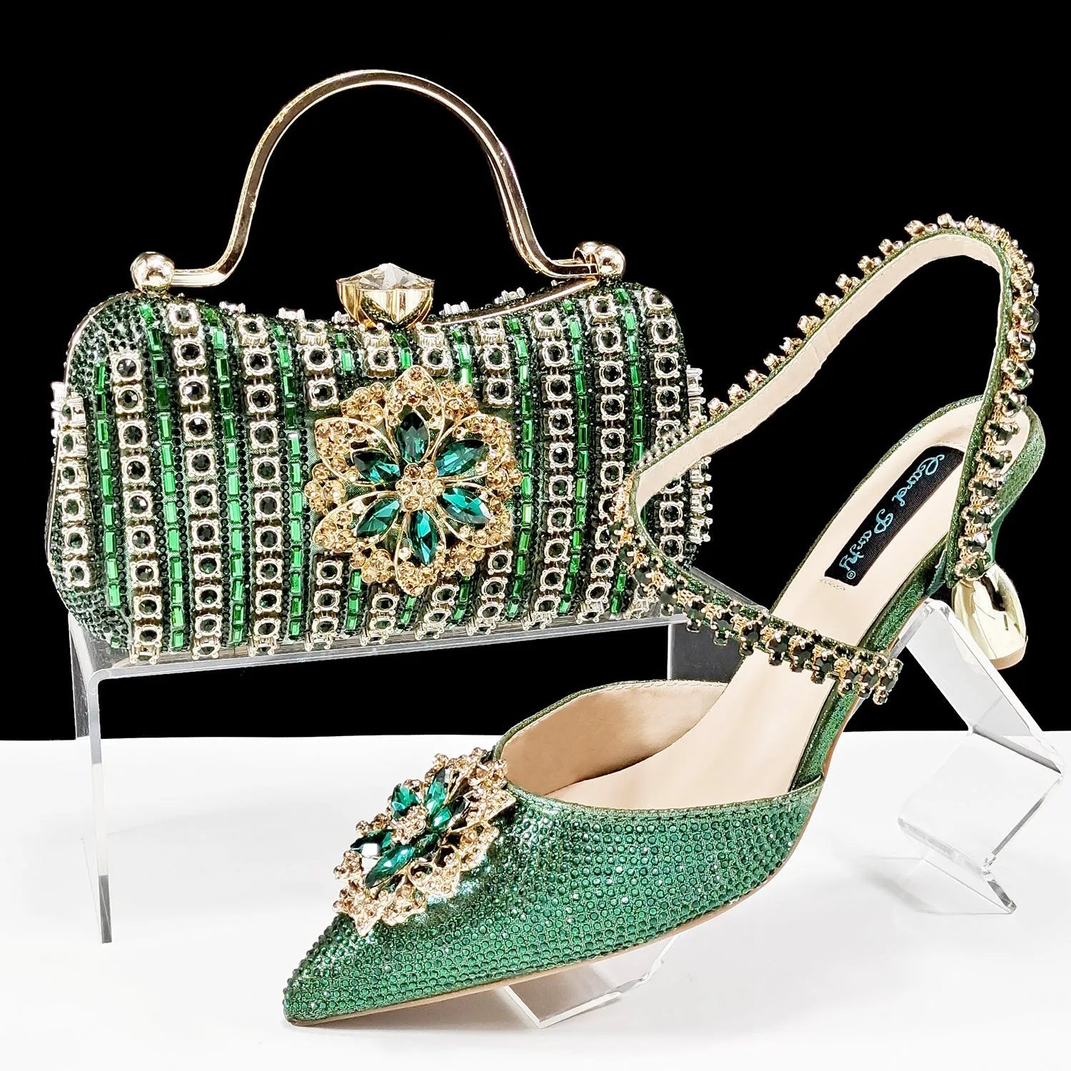 Women's high heel shoes with matching clutch bag featuring decorative flower buckle and ankle chain detail