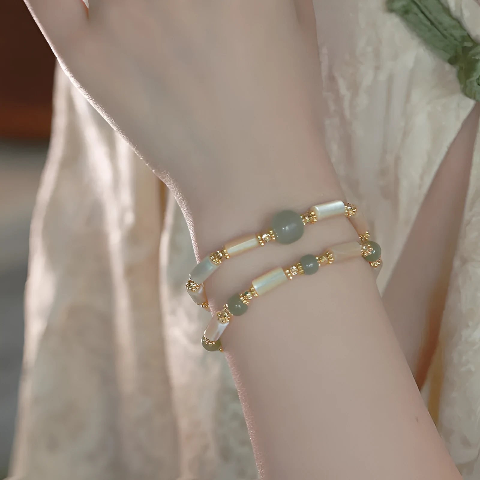 Hetian jade white lip shell bracelet with geometric round design on wrist