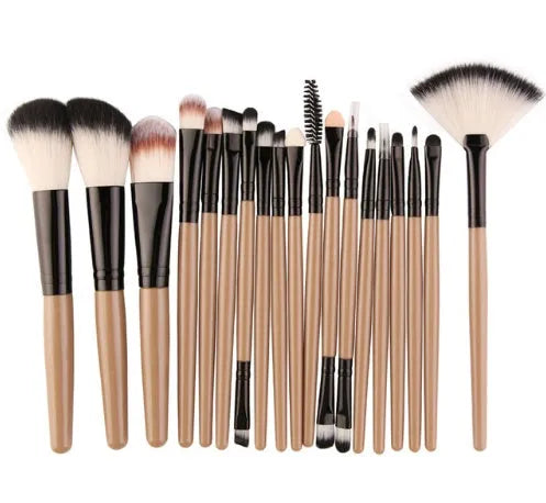 18-piece makeup brush set with fan brushes arranged on a table.