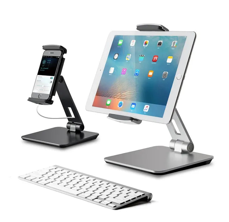 Silver aluminium and ABS folding stand holding a tablet, showing 360-degree rotation and anti-slip silicone pads.