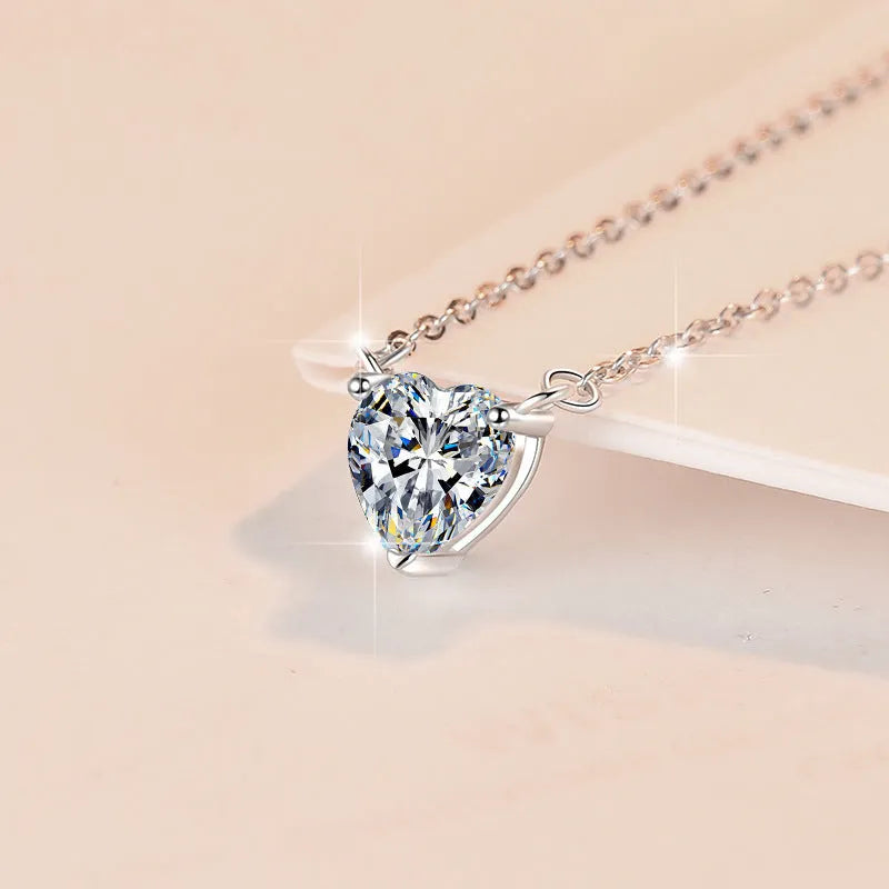 925 silver heart-shaped moissanite pendant necklace with cross chain on display