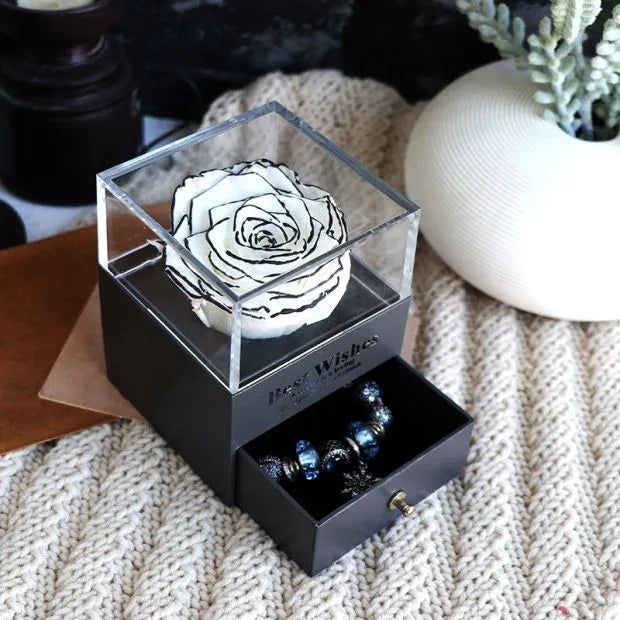 Eternal Flower gift box with preserved roses and carnations inside, measuring 8.5 cm square by 10.5 cm high