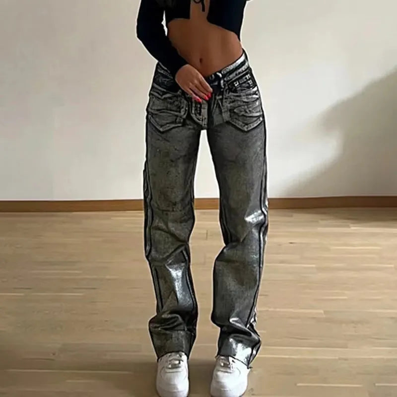 Women's washed blue high waist straight leg jeans with silver contrast details on back pockets
