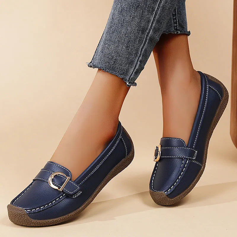 Women's casual flat loafers in artificial PU leather with a rounded toe and beef tendon sole.