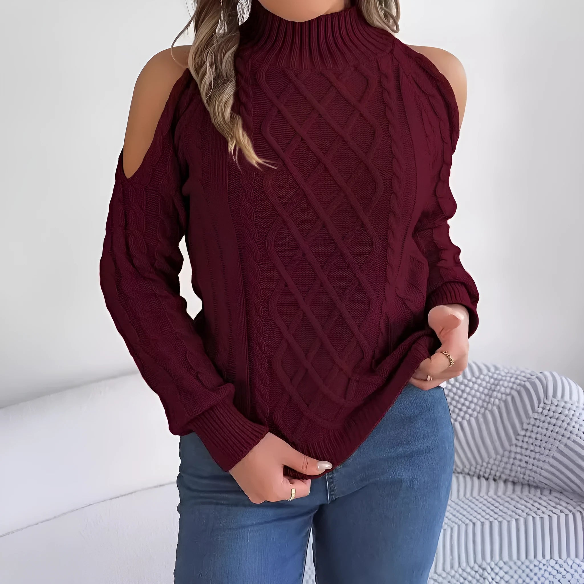Gray women's acrylic sweater with a twist detail, strapless half-high collar, and long lantern sleeves.