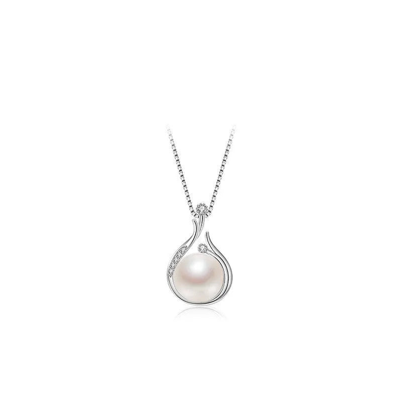 S925 silver necklace with natural freshwater pearl and geometric mother-of-pearl pendant on cross chain over a knitted sweater