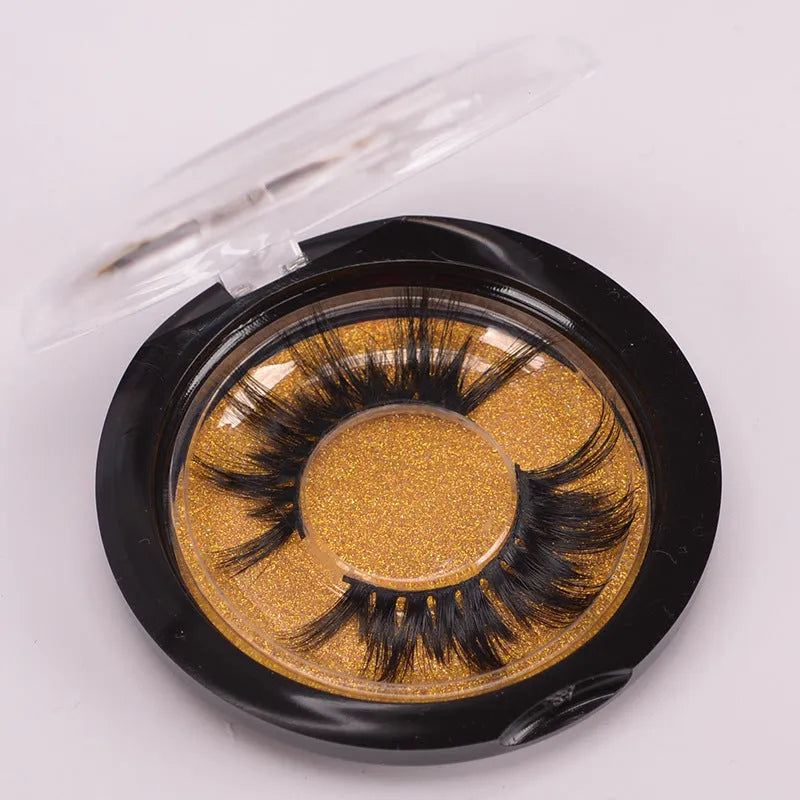 Handmade 5D volume false eyelashes made from mink hair with a storage case and application brush.