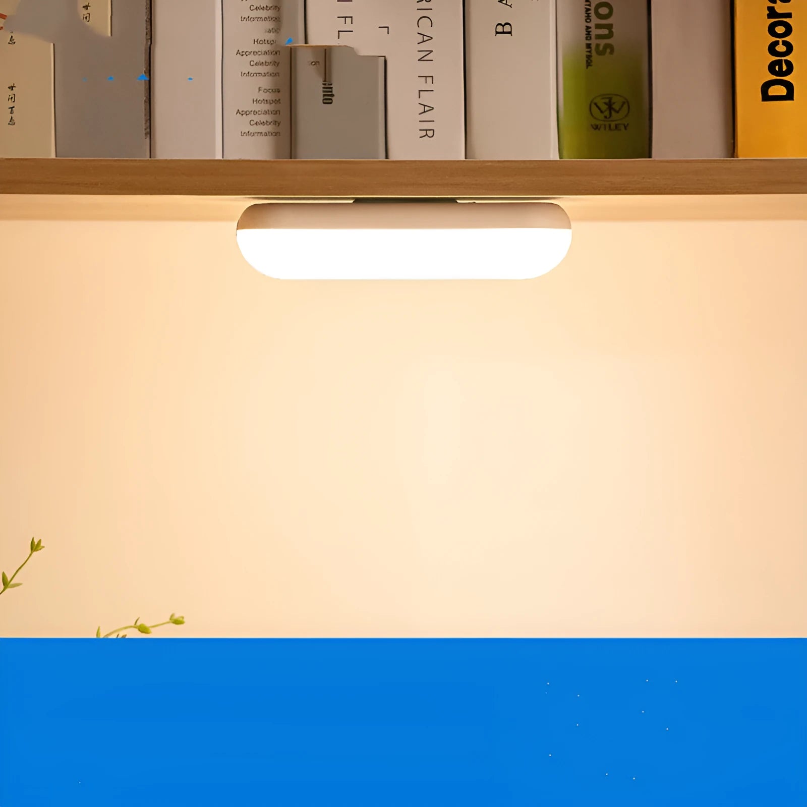 White and black portable magnetic LED desk lamp with adjustable dimming on a wooden desk