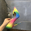 Rainbow glossy patent leather high heel shoes with pointed toe and thin ultra-high heel.