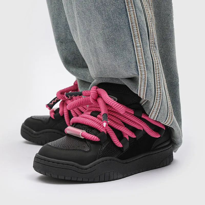 Casual low-top lace-up shoes in a solid colour with a round toe and thick rubber sole.