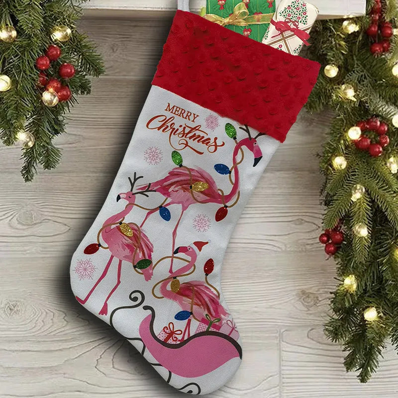 Red cloth Christmas stocking with flamingo design, 46cm long, hanging on fireplace.