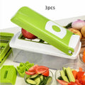 Green 12-piece manual vegetable chopper set with stainless steel blades on a kitchen counter.