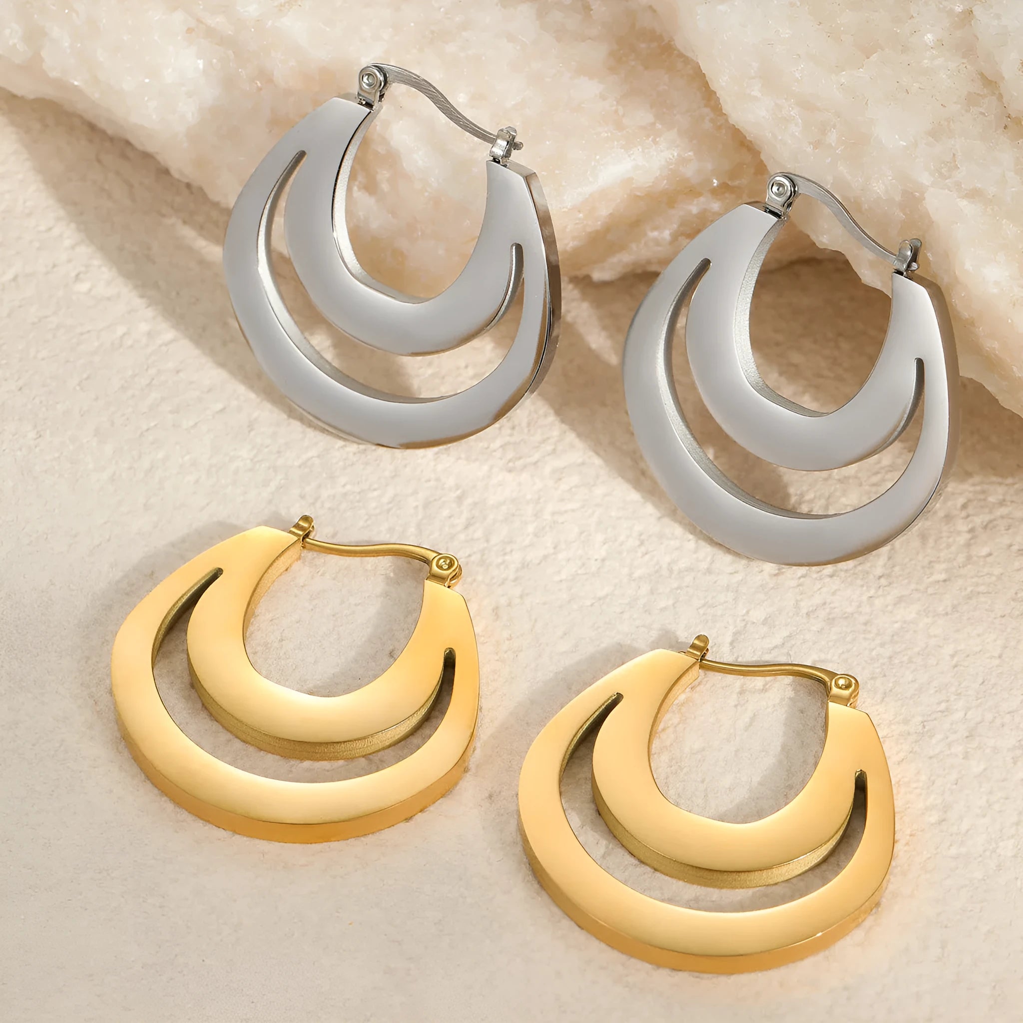 Geometric French hook earrings with round design in gold and steel metallic finishes