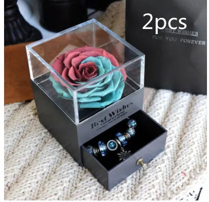 Eternal Flower gift box with preserved roses and carnations inside, measuring 8.5 cm square by 10.5 cm high