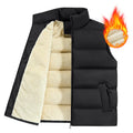 Men's striped lambswool vest or waistcoat in black, shown as a layering piece for winter.