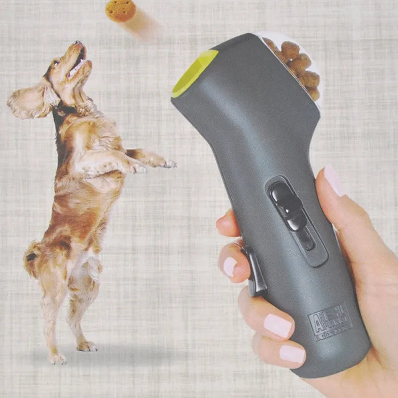 Grey pet snack catapult launcher for dogs and cats on a neutral background.