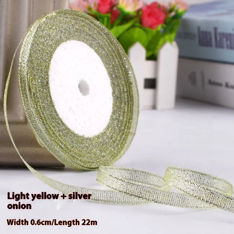 Roll of 0.6cm wide coloured polyester gift ribbon with 22 metre length.