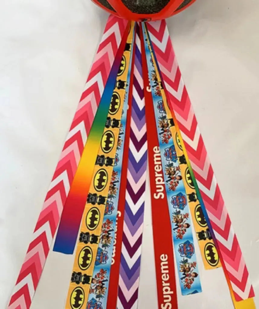 A colourful helmet streamer accessory for children's sports helmets and doll decoration.