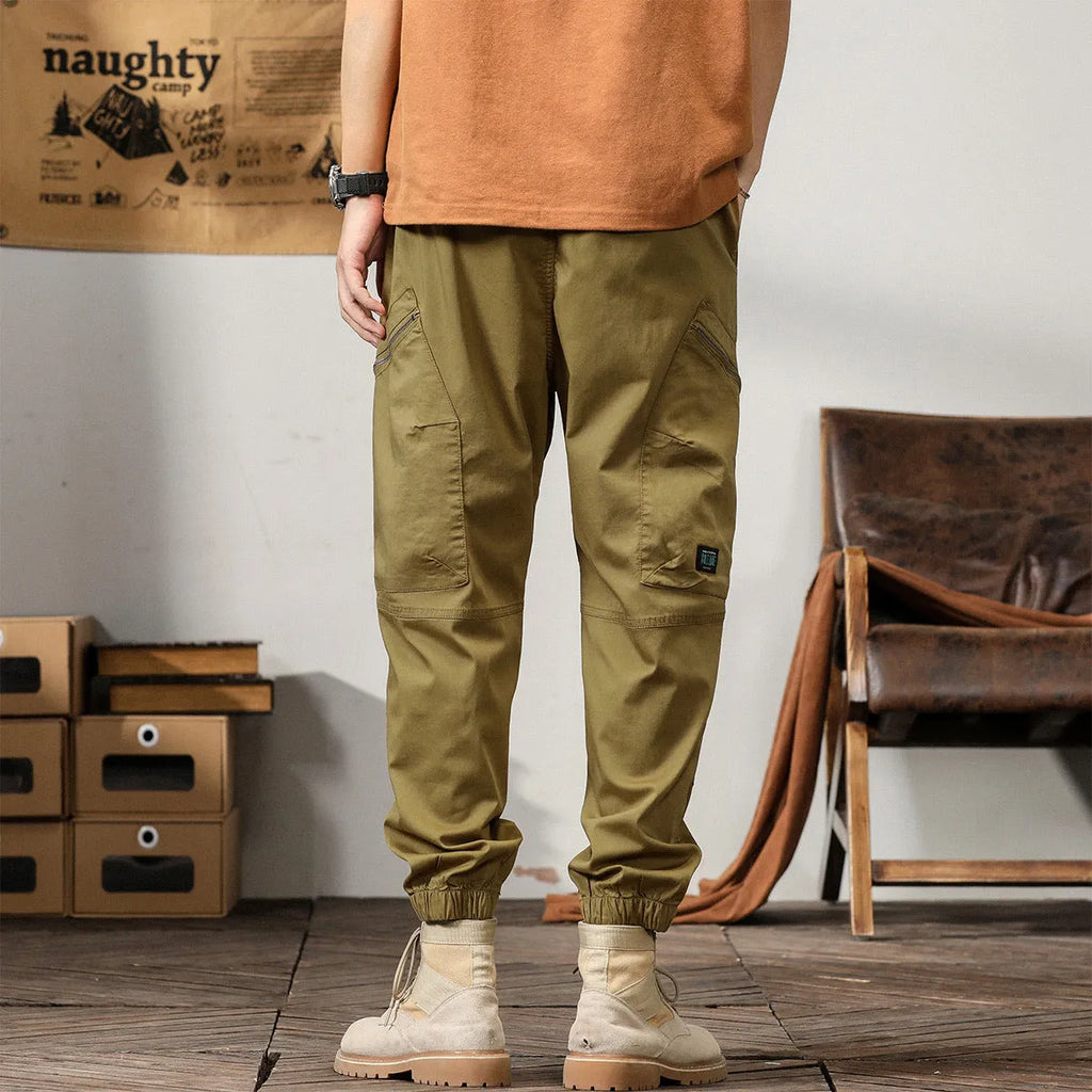 Men's cotton retro harem pants in tapered fit with ankle banding and zip fly