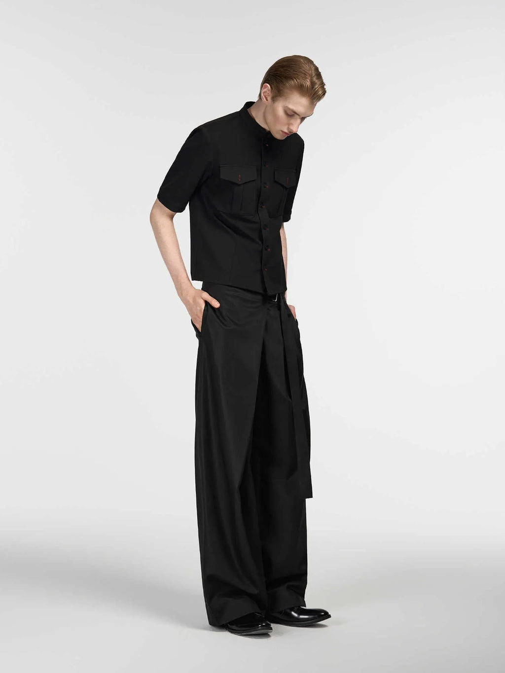 Black straight leg trousers with adjustable waistband and single pleated front detail