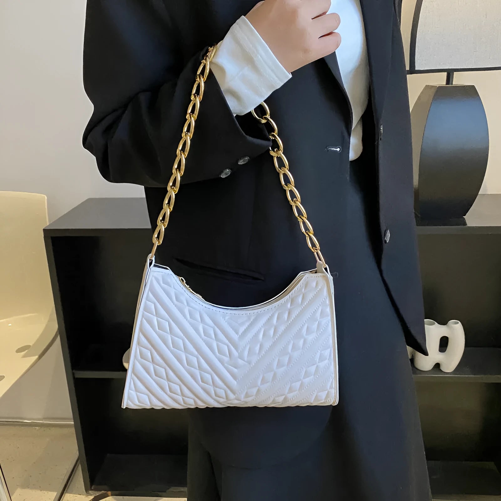 Soft PU leather pleated chain baguette shoulder bag in a vertical square shape, shown in brown colour.
