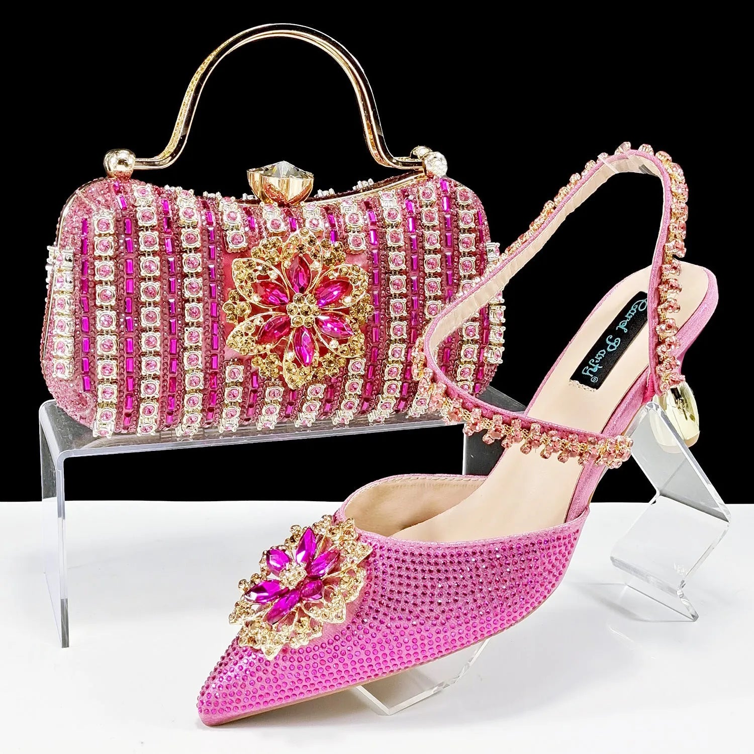 Women's high heel shoes with matching clutch bag featuring decorative flower buckle and ankle chain detail