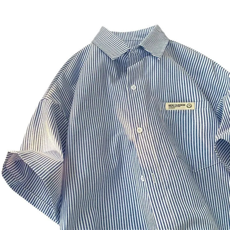 Blue and green striped loose plus size half sleeve polyester shirt on hanger