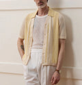 Yellow casual polo shirt with hollow-out pattern and asymmetric design, short sleeves