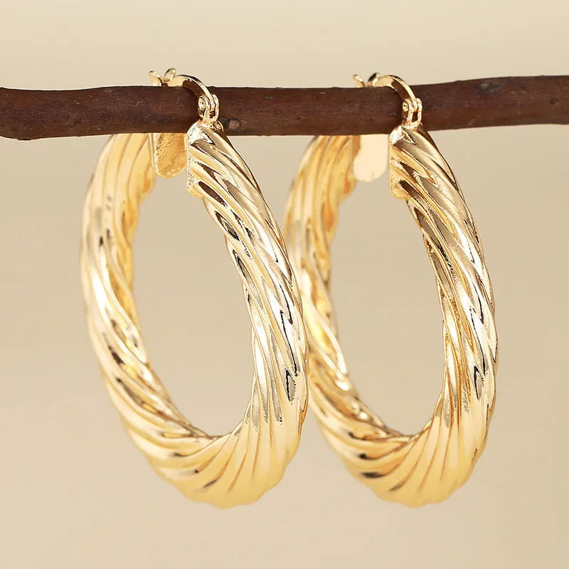 Copper geometric ring design ear clip earrings for women in assorted colours.