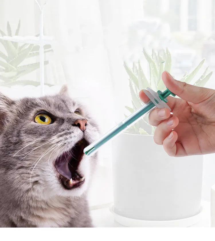Two pet pill shooters with soft silicone tips for administering tablets to cats and dogs.