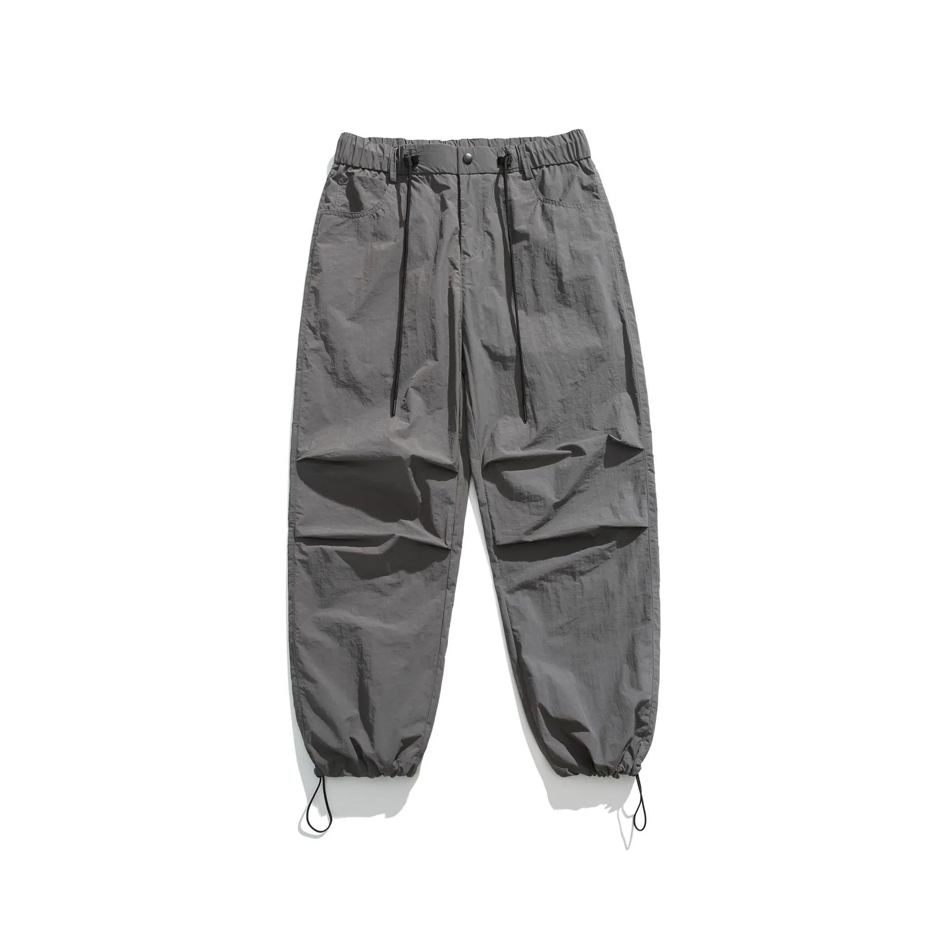 Man wearing loose straight-leg casual trousers in thin ice silk nylon fabric, showing apricot colour option.