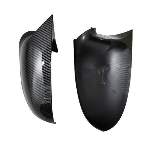 Pair of plastic Volkswagen Sagitar mirror housings in bright black and carbon fibre style finishes.