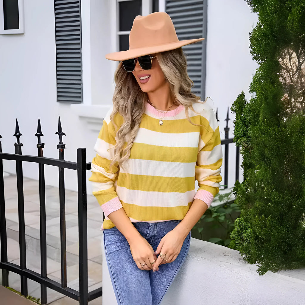 Women's loose long sleeve acrylic sweater in blue with stripes, round neck.