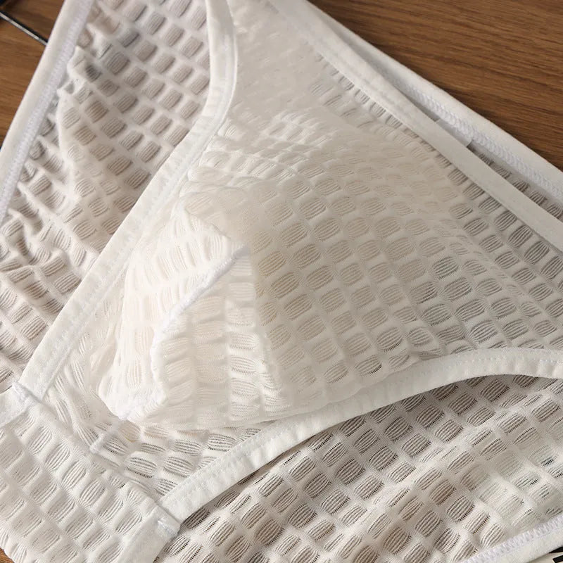 Men's low waist transparent visual underwear in nylon lace fabric showing breathable quick-drying construction