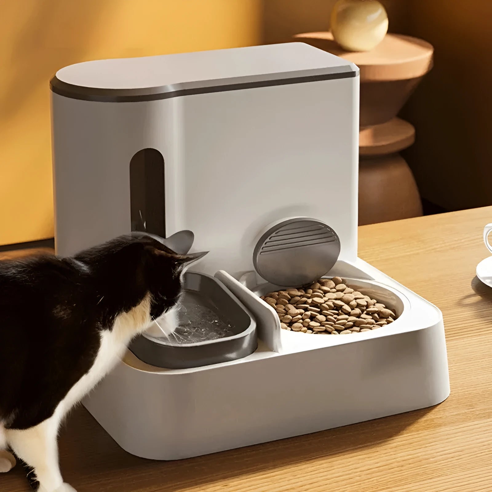 Grey automatic cat feeder and water dispenser unit with integrated double bowls