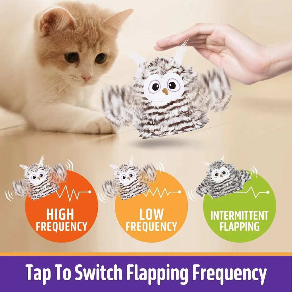 Grey owl-shaped automatic cat toy with flapping wings on a flat surface