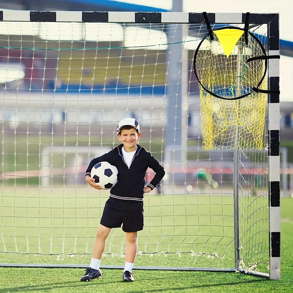 Black portable soccer training goal net set up on grass, showing 130cm square frame and netting.